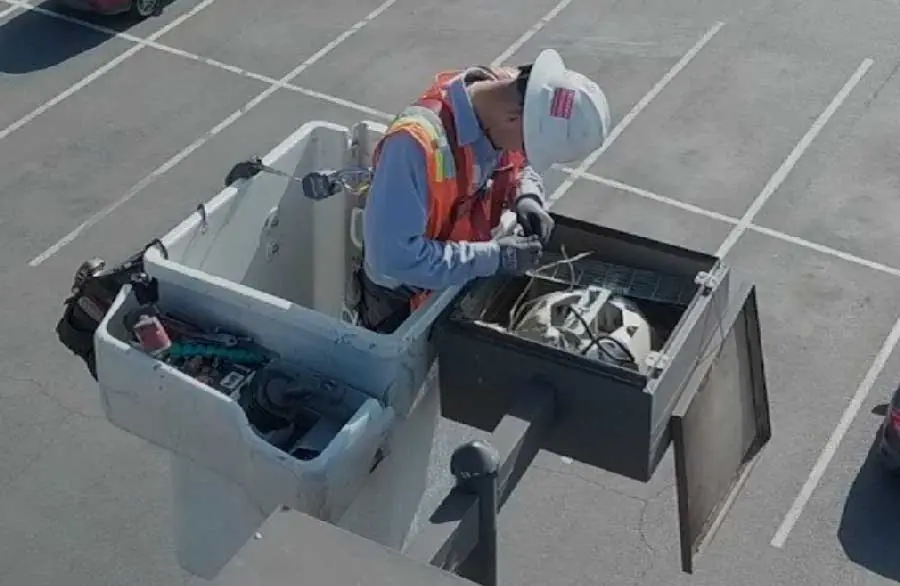 Lighting Management bucket truck servicing a light pole