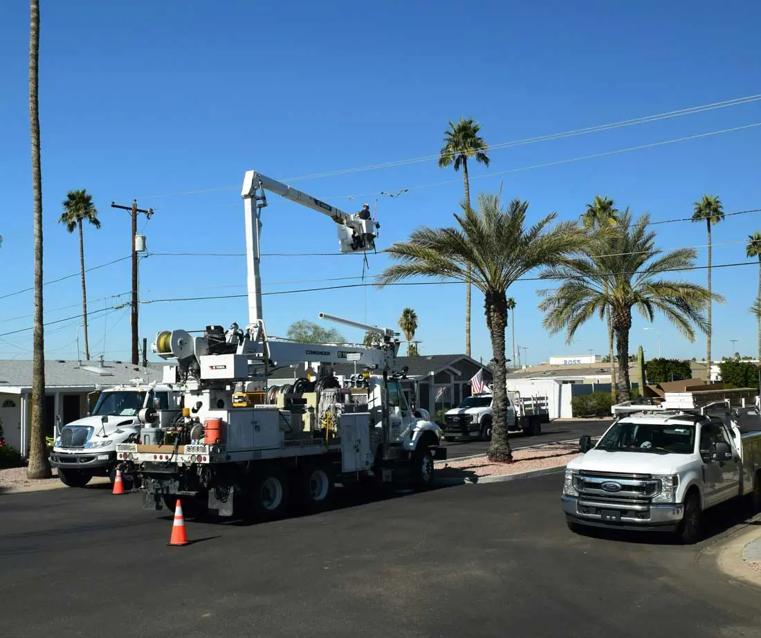 Bucket truck with the boom extended to a light pole
