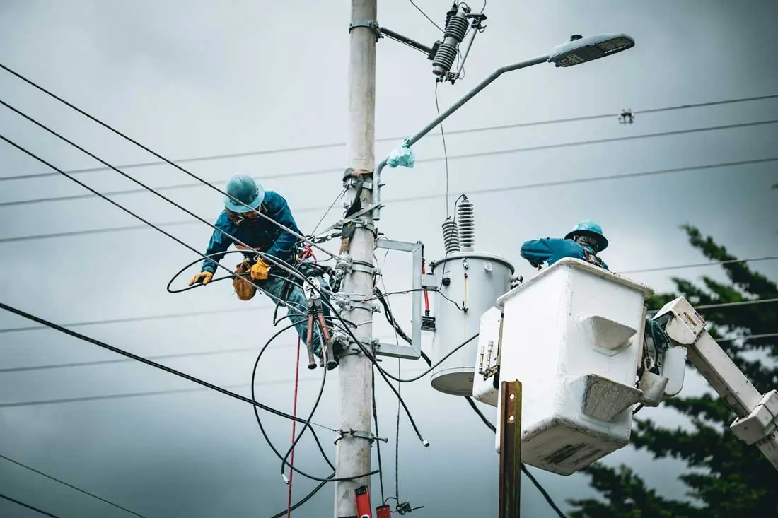 Licensed electrician working from a bucket truck